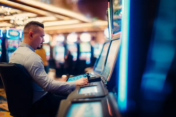 A young woman relaxing with her phone while dynamic casino elements float around her, illustrating the smooth mobile experience offered by the BET786 app.