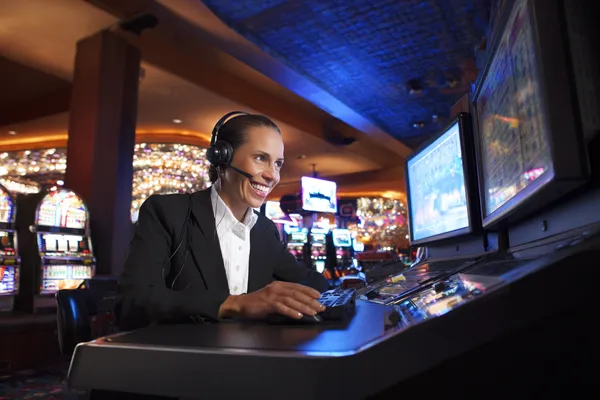 A cheerful woman in traditional clothing using her smartphone during a festive moment, showing how easily the BET786 app fits into everyday life.