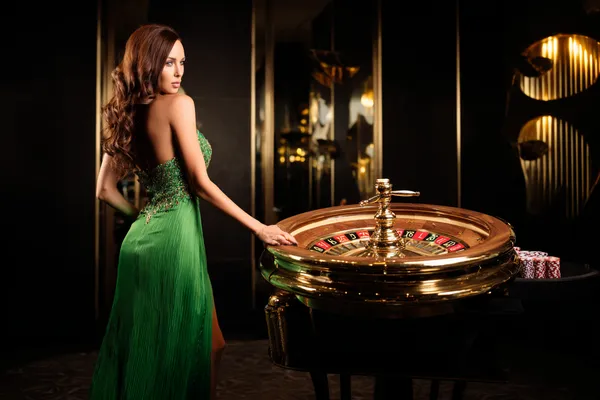 A person using their device against a moody casino-themed background, illustrating the smooth re-entry process at BET786.
